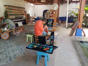 One of the artists at Fabrica de Carretas: oxcart factory in Sarchi, Costa Rica